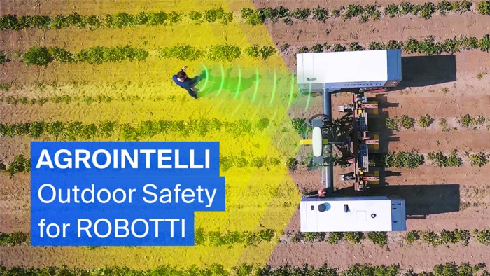 Autonomous agricultural robot in action on a field.